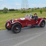 Red car racing the mille miglia race