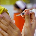 FILE PHOTO: People receive the Sinovac COVID-19 vaccine at the Thai resort island of Phuket