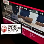 STUTTGART, GERMANY – Feb 11, 2021: Person holding cellphone with logo of Banca Monte dei Paschi di Siena (BMPS) on screen with web page