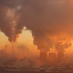 Polluting factory at dawn