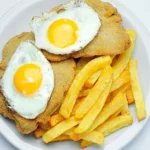 Milanesa a caballo Foto Clarin