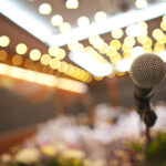 Close up of microphone in concert hall or conference room